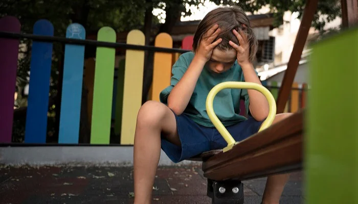 mental health in schools in India showing sad kid on see-saw